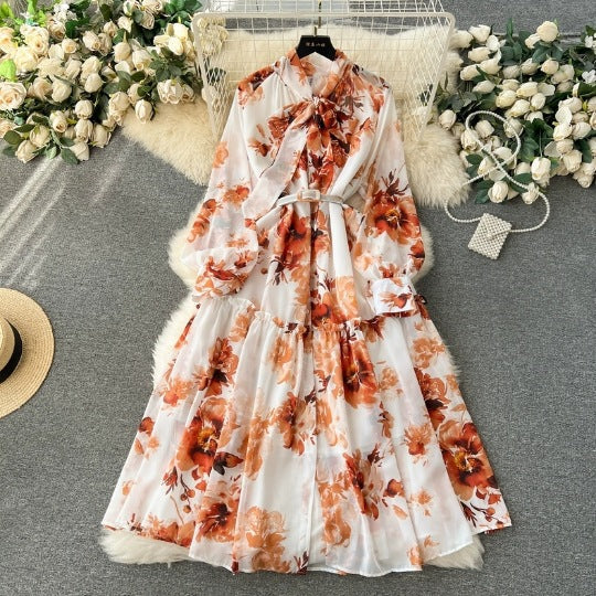 Rochie Tulia portocalie cu imprimeu floral si curea accesorizata